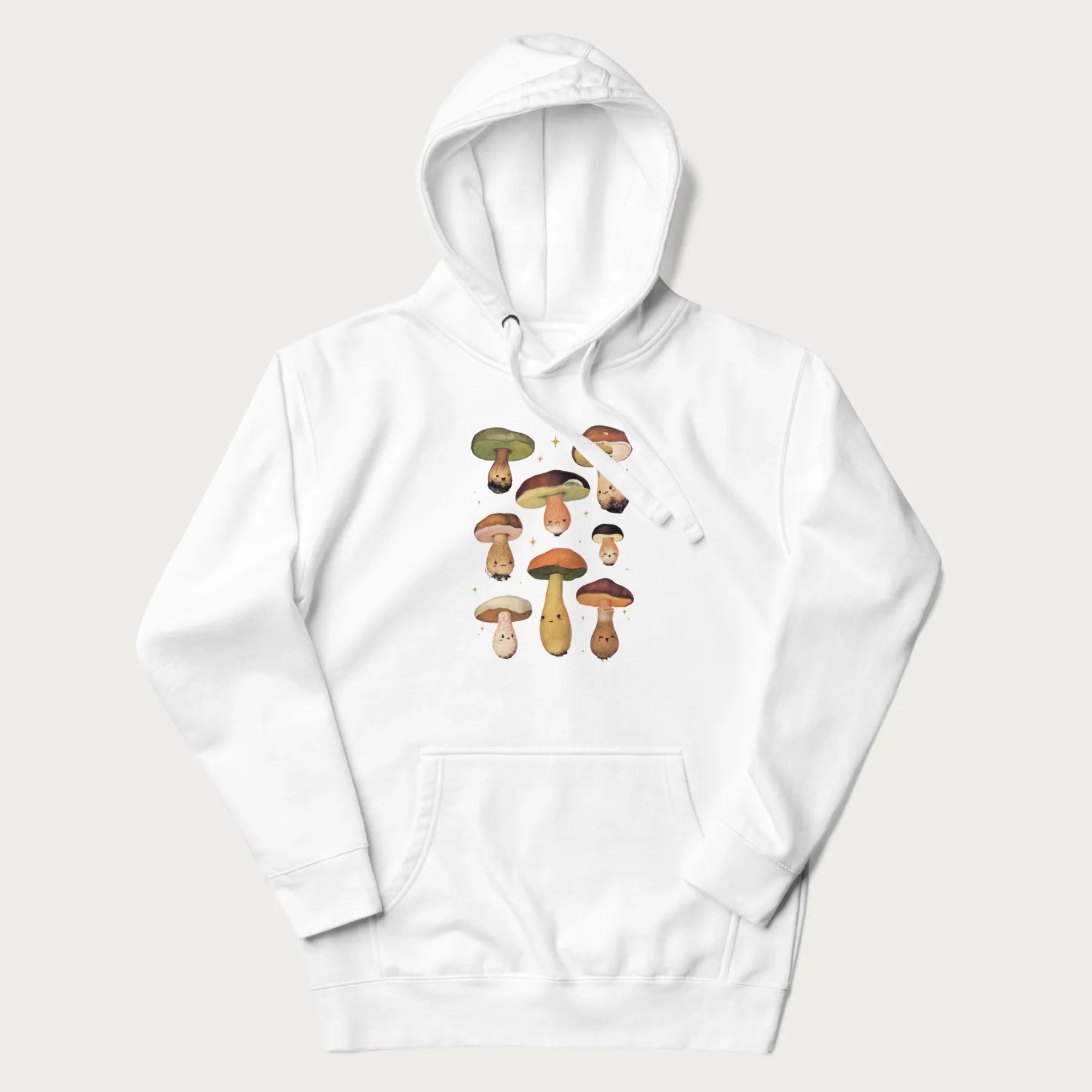 White hoodie with Japanese graphic of cute and expressive mushrooms with various faces.