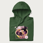Folded forest green hoodie with Japanese text '拉麵!!!' (Ramen!!!) in vibrant pink and realistic ramen bowl graphic.