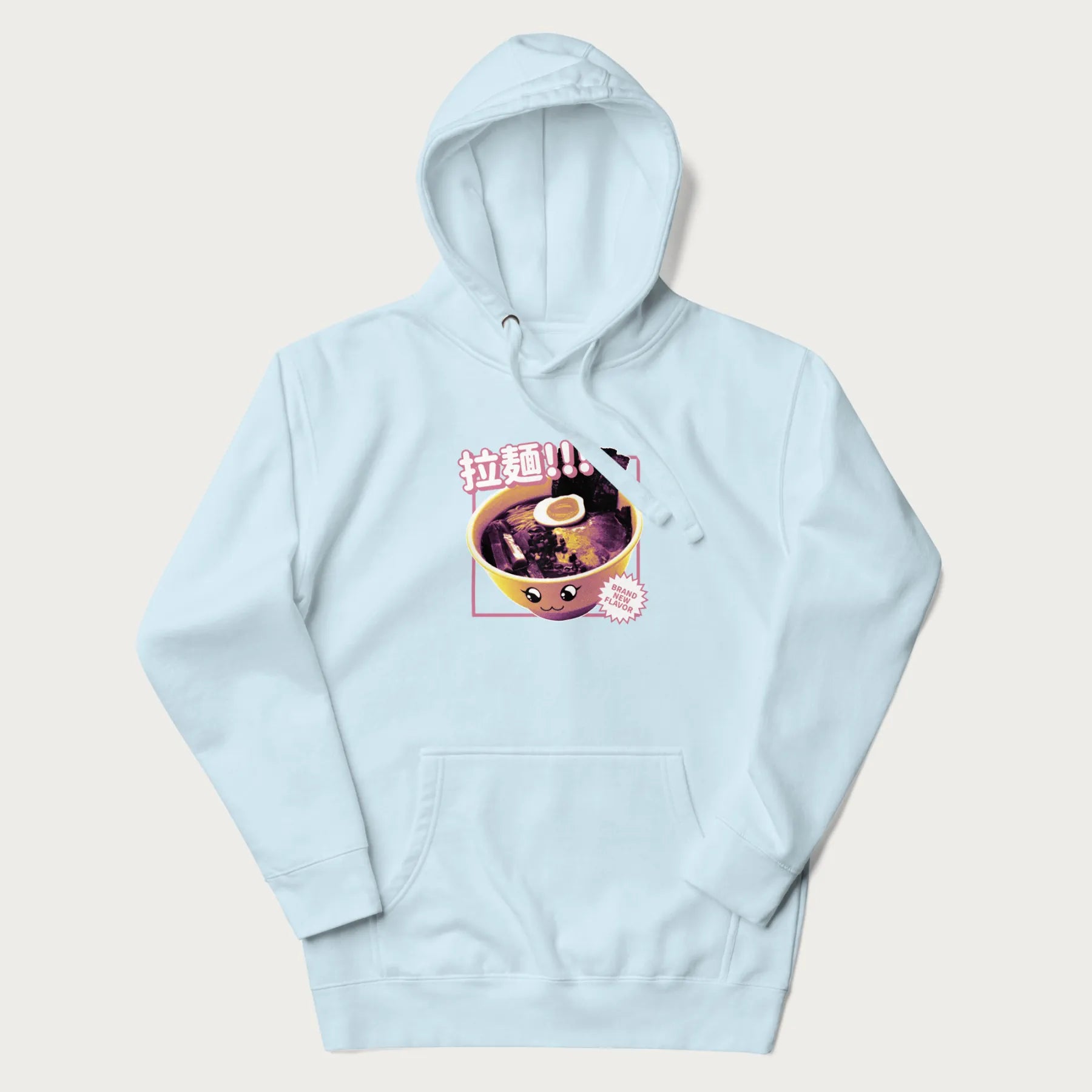Light blue hoodie with Japanese text '拉麵!!!' (Ramen!!!) in vibrant pink and realistic ramen bowl graphic.