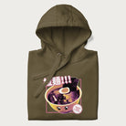 Folded military green hoodie with Japanese text '拉麵!!!' (Ramen!!!) in vibrant pink and realistic ramen bowl graphic.