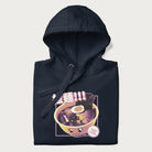 Folded navy blue hoodie with Japanese text '拉麵!!!' (Ramen!!!) in vibrant pink and realistic ramen bowl graphic.
