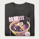 Folded dark grey sweatshirt with Japanese text and a kawaii ramen bowl graphic.