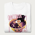 Folded white sweatshirt with Japanese text and a kawaii ramen bowl graphic.