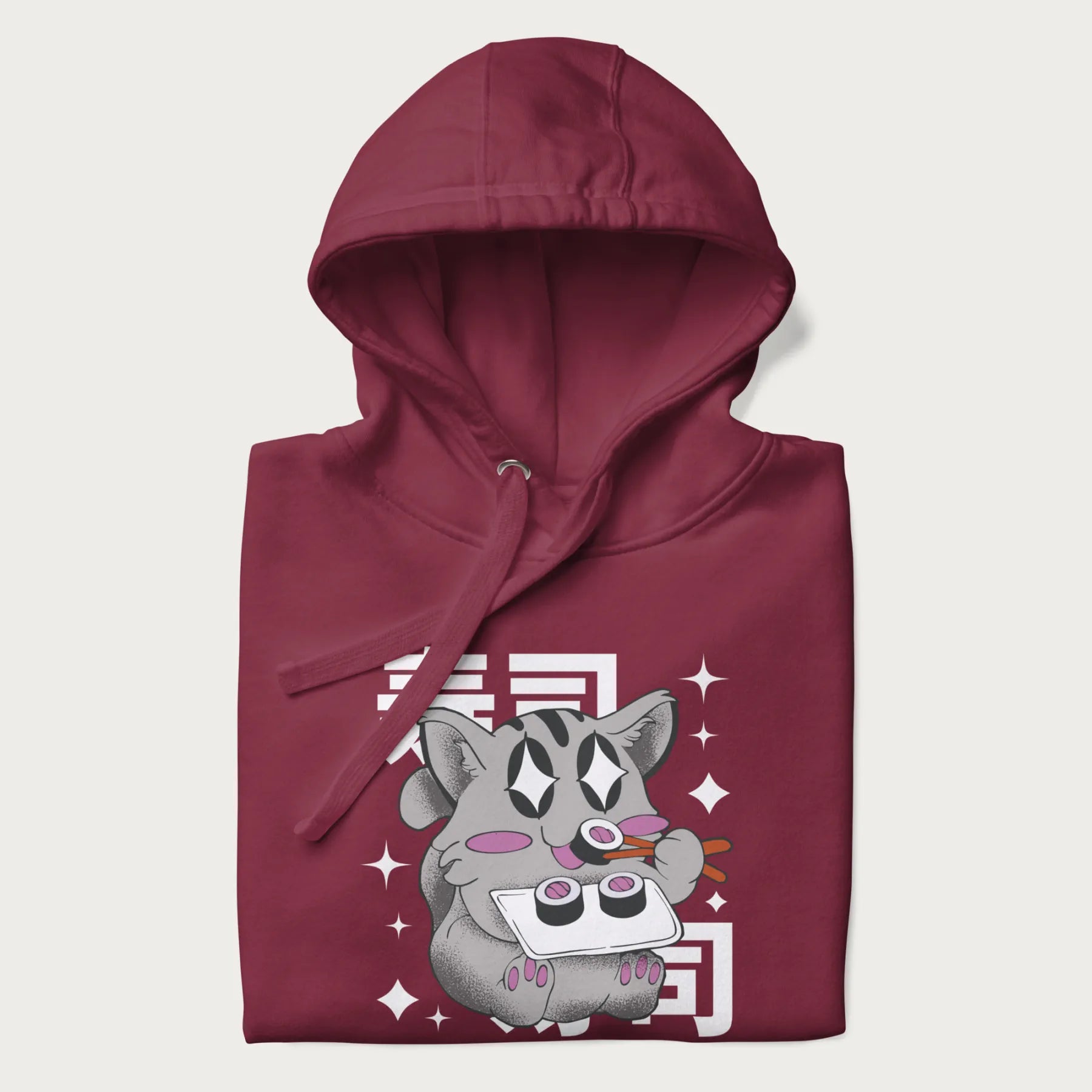 Folded maroon hoodie with Japanese graphic of a cute grey cat eating sushi, with the Japanese text '寿司' (Sushi) in the background.