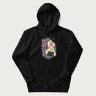 Black hoodie featuring a cute sushi and onigiri graphic with the text "Kawaii Sushi Club", colorful neon accents and Japanese characters.