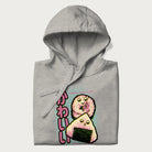Folded light grey hoodie featuring a cute sushi and onigiri graphic with the text "Kawaii Sushi Club", colorful neon accents and Japanese characters.