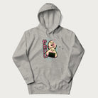 Light grey hoodie featuring a cute sushi and onigiri graphic with the text "Kawaii Sushi Club", colorful neon accents and Japanese characters.