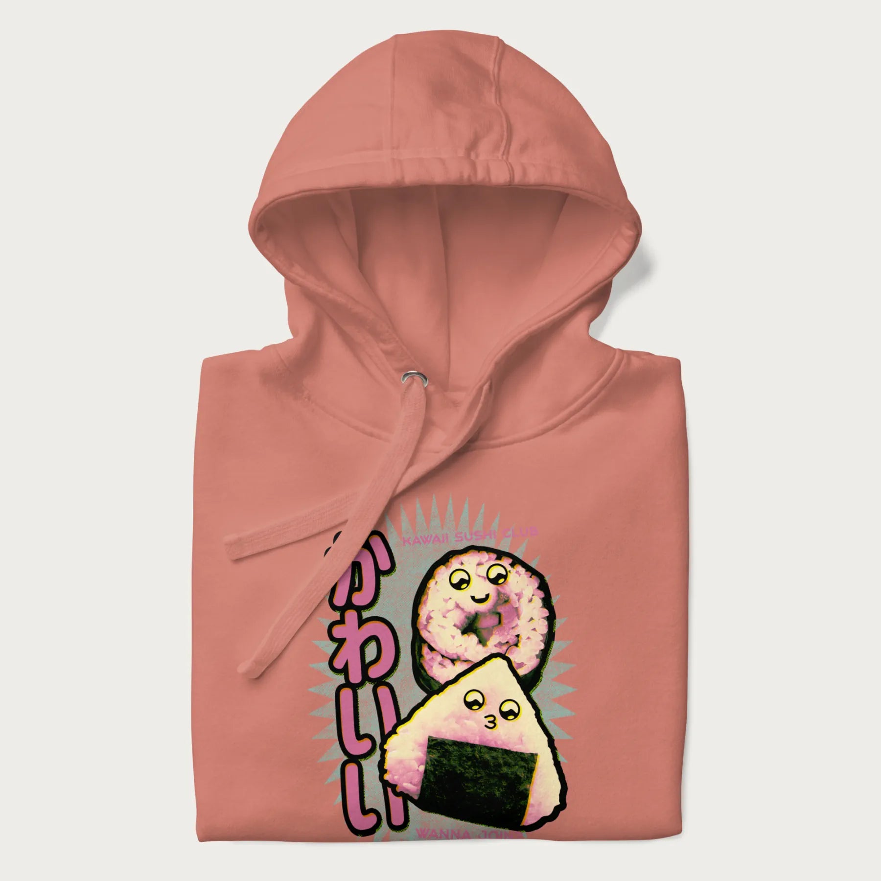 Folded light pink hoodie featuring a cute sushi and onigiri graphic with the text "Kawaii Sushi Club", colorful neon accents and Japanese characters.
