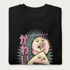 Folded black sweatshirt with a cute graphic of a sushi roll and onigiri, featuring the Japanese text 'Kawaii.'