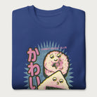 Folded royal blue sweatshirt with a cute graphic of a sushi roll and onigiri, featuring the Japanese text 'Kawaii.'