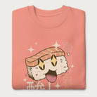 Folded light pink sweatshirt with Japanese text and a kawaii nigiri sushi graphic.