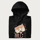 Folded black hoodie with Japanese graphic of a cute sushi with sparkling eyes accompanied by Japanese text '寿司の時間' (Sushi Time).