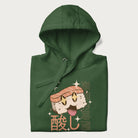 Folded forest green hoodie with Japanese graphic of a cute sushi with sparkling eyes accompanied by Japanese text '寿司の時間' (Sushi Time).