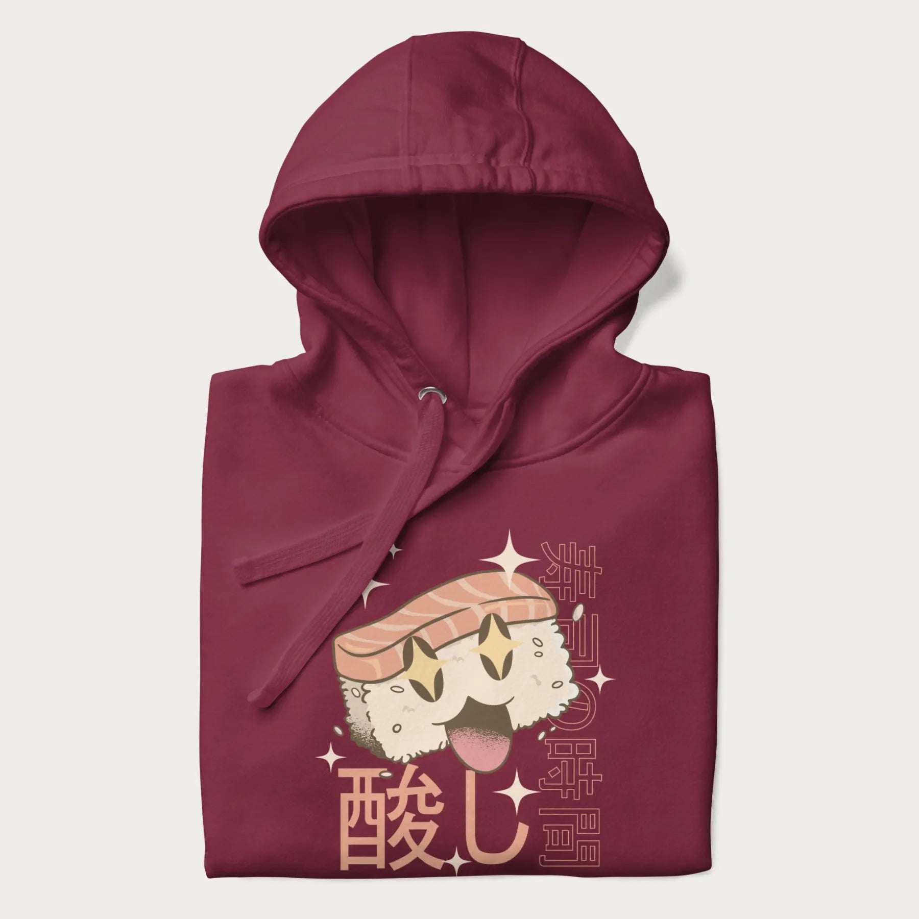 Folded maroon hoodie with Japanese graphic of a cute sushi with sparkling eyes accompanied by Japanese text '寿司の時間' (Sushi Time).