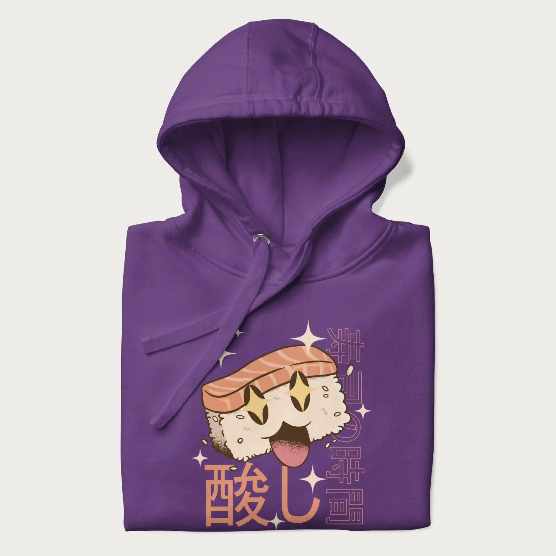 Folded purple hoodie with Japanese graphic of a cute sushi with sparkling eyes accompanied by Japanese text '寿司の時間' (Sushi Time).