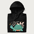 Folded black hoodie with graphic of a turtle and duck with sunglasses and the text 'Late but Worth the Wait'.