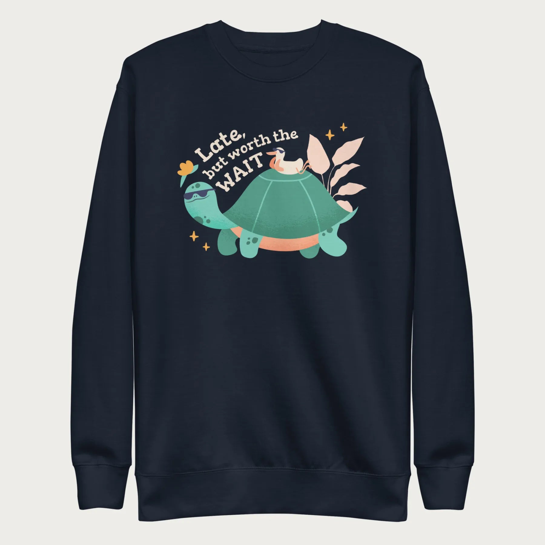 Navy blue sweatshirt with a graphic of a turtle and bird wearing sunglasses with the phrase 'Late But Worth the Wait.'