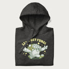 Folded dark grey hoodie with a retro-inspired graphic of a mushroom mascot character and the text 'Let's Get Fungi'.