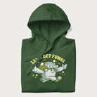 Folded forest green hoodie with a retro-inspired graphic of a mushroom mascot character and the text 'Let's Get Fungi'.