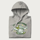 Folded light grey hoodie with a retro-inspired graphic of a mushroom mascot character and the text 'Let's Get Fungi'.