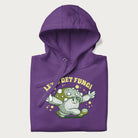 Folded purple hoodie with a retro-inspired graphic of a mushroom mascot character and the text 'Let's Get Fungi'.