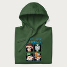 Folded forest green hoodie with a pixel art graphic of four mushroom characters and the text 'Let's Get Fungi'.