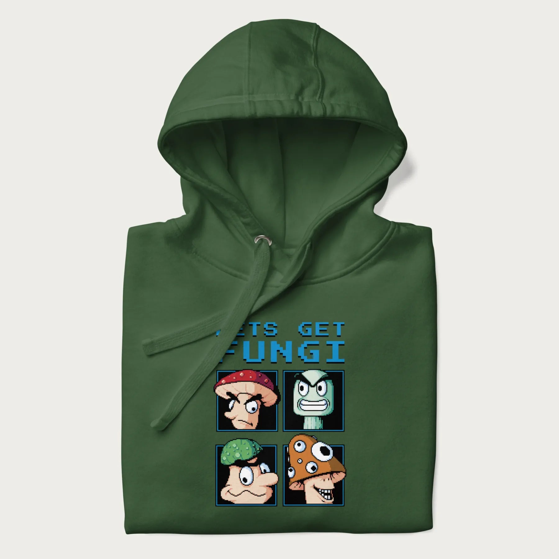 Folded forest green hoodie with a pixel art graphic of four mushroom characters and the text 'Let's Get Fungi'.