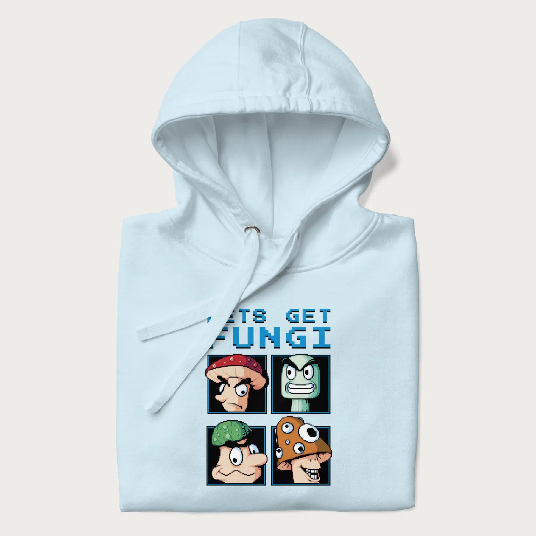 Folded light blue hoodie with a pixel art graphic of four mushroom characters and the text 'Let's Get Fungi'.