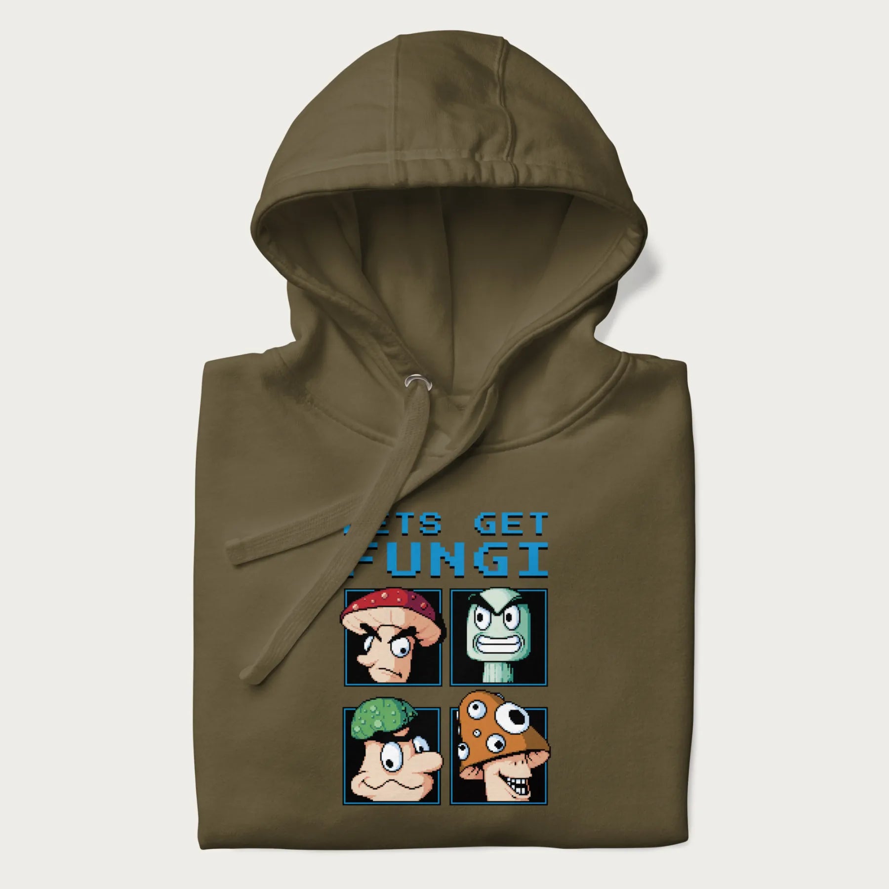 Folded military green hoodie with a pixel art graphic of four mushroom characters and the text 'Let's Get Fungi'.