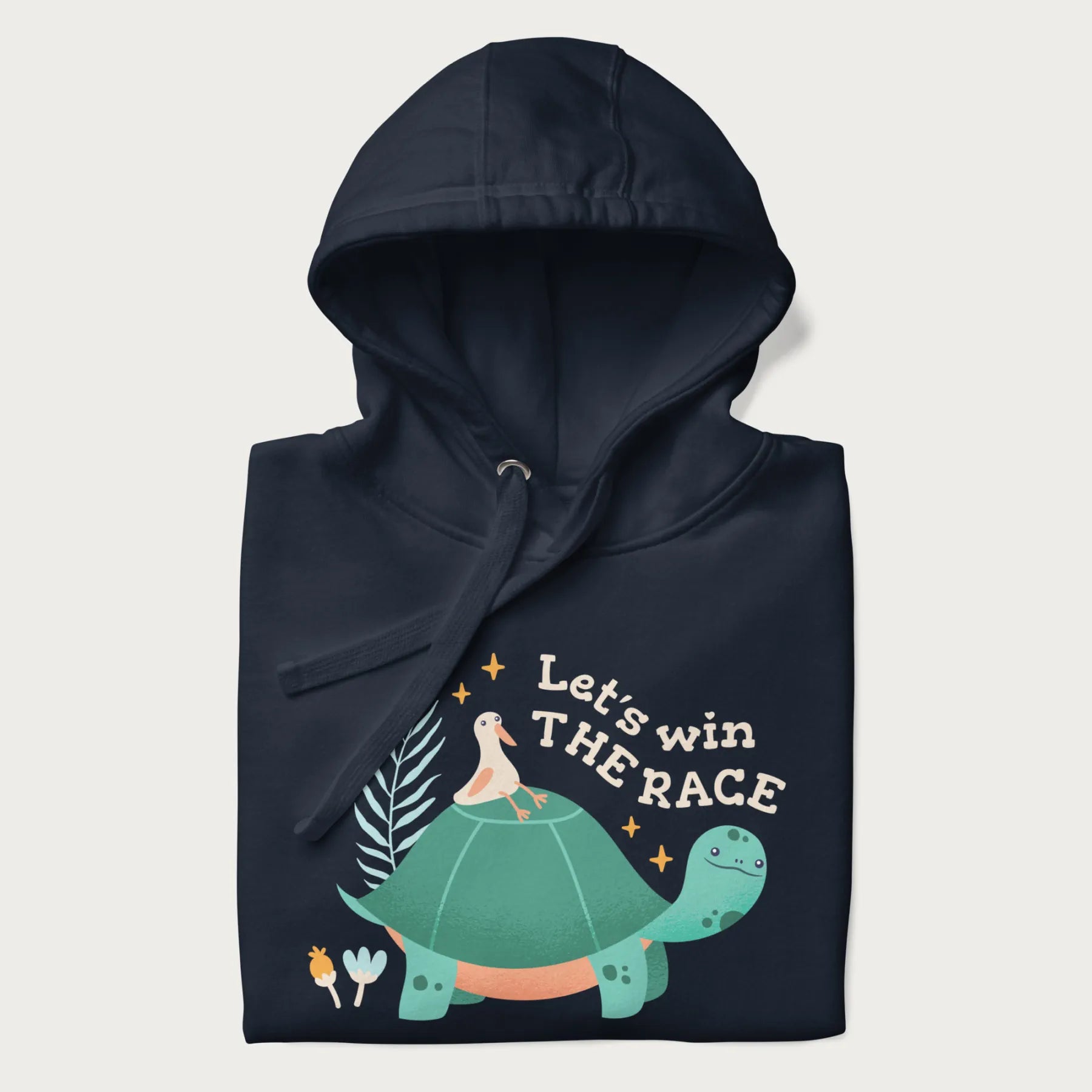 Folded navy blue hoodie with a graphic of a turtle with a duck on its back and the text 'Let's Win the Race'.