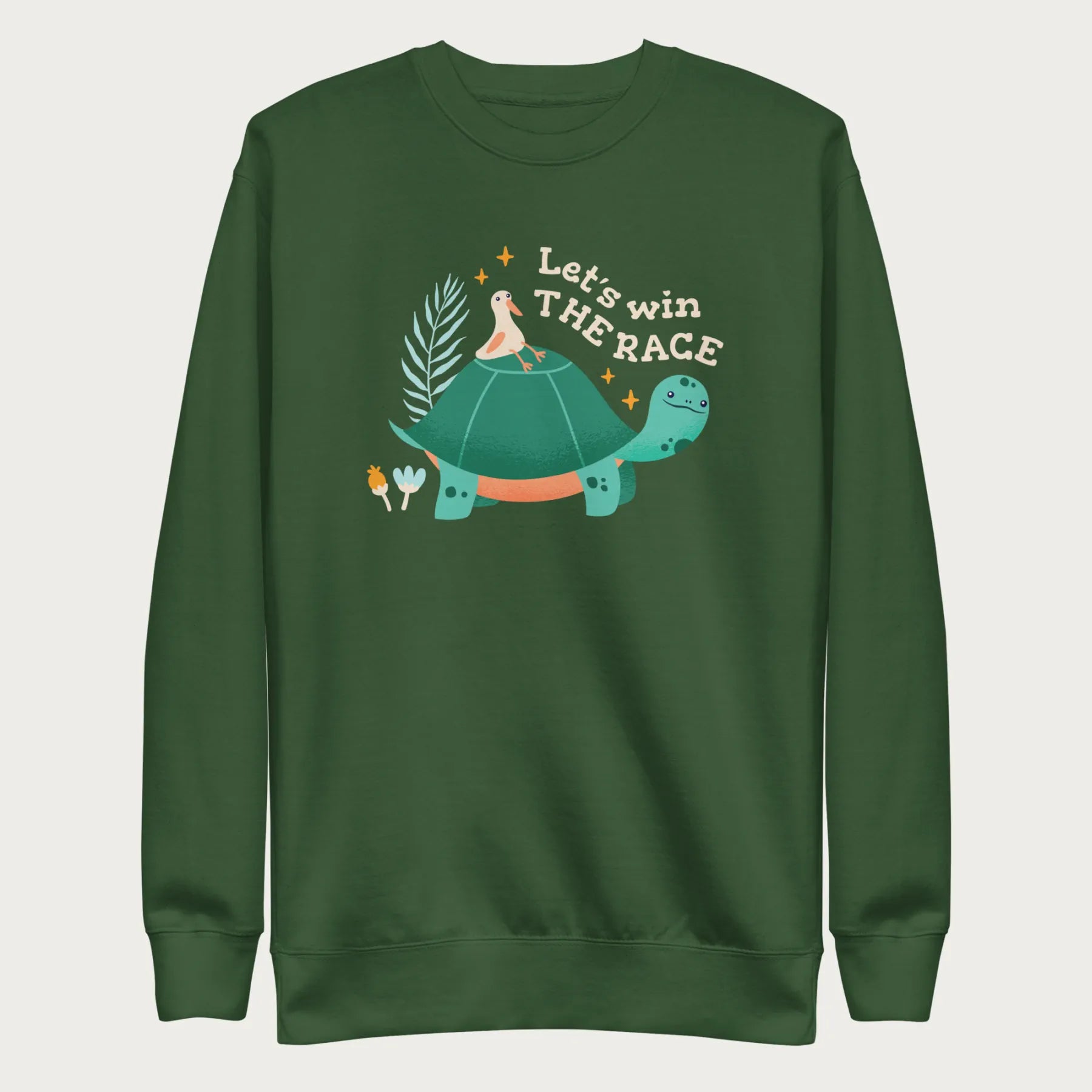 Forest green sweatshirt with a graphic of a turtle with a bird on it's shell with the phrase 'Let's Win the Race.'