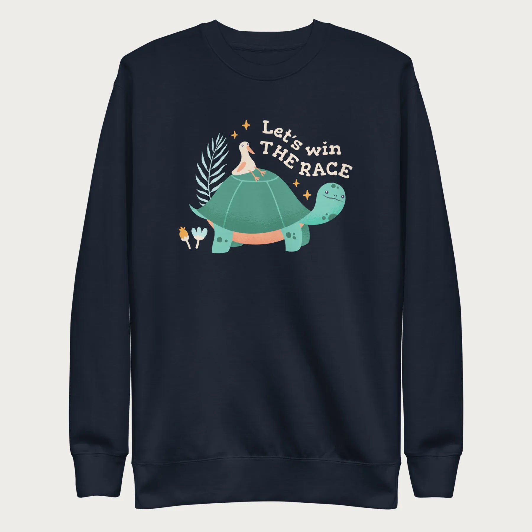 Navy blue sweatshirt with a graphic of a turtle with a bird on it's shell with the phrase 'Let's Win the Race.'