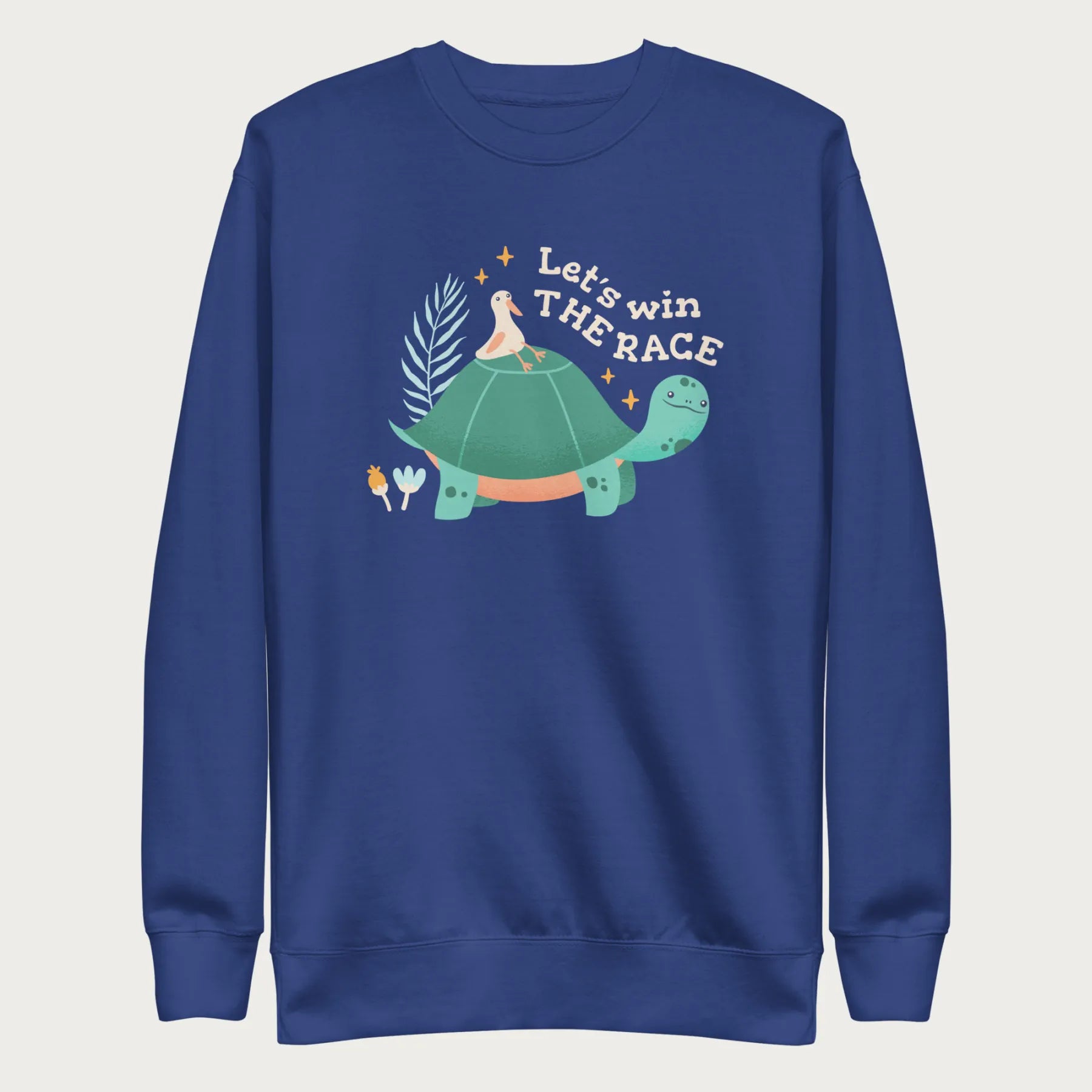 Royal blue sweatshirt with a graphic of a turtle with a bird on it's shell with the phrase 'Let's Win the Race.'