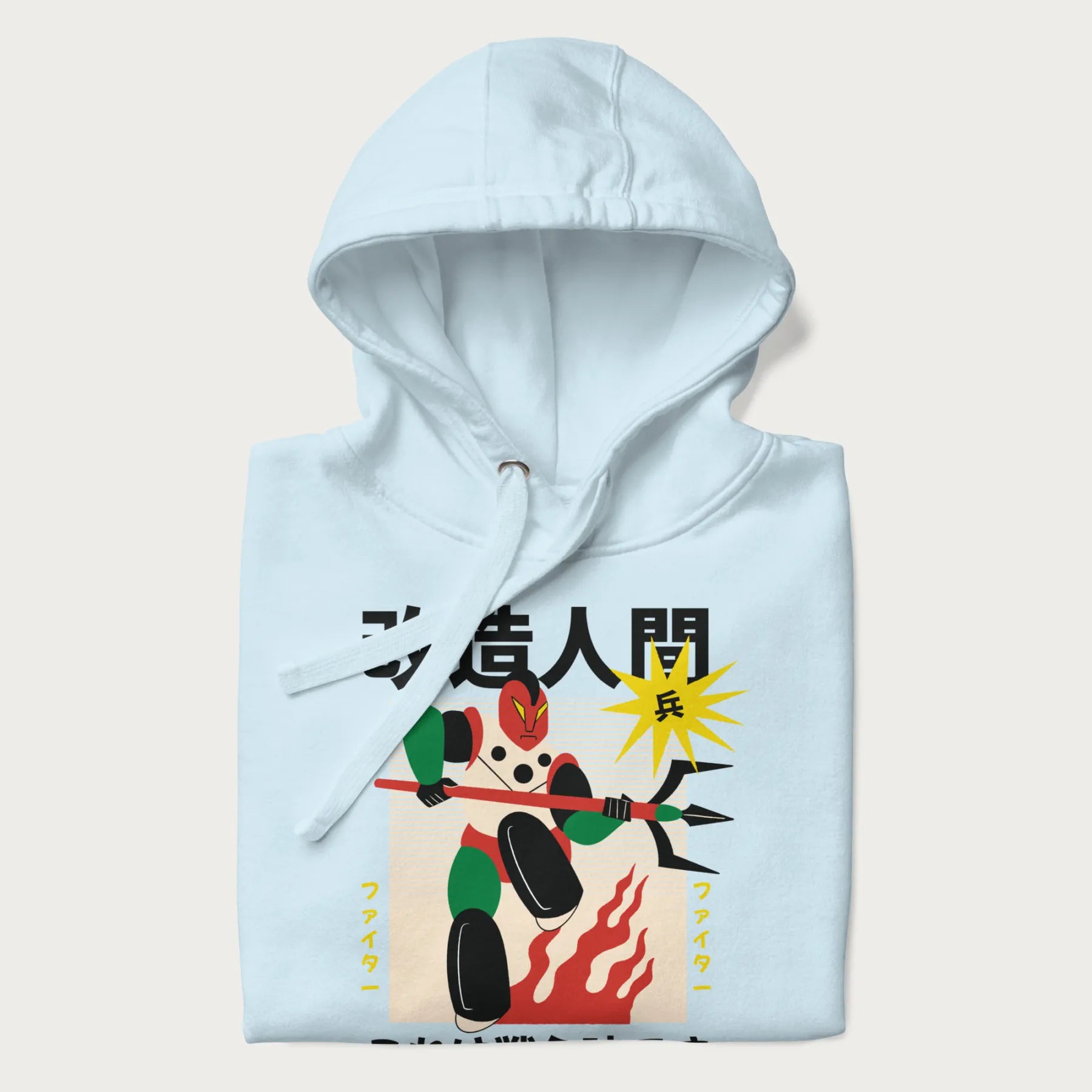 Folded light blue hoodie with Japanese graphic of a mech warrior in vibrant green and red, with Japanese characters symbolizing battle and courage.