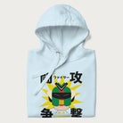 Folded light blue hoodie with retro graphic of a mecha warrior and Japanese text for "Fight," "Attack," "Conflict," and "Destiny to defeat them all".