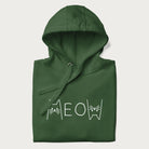 Folded green meow hoodie with a simple 'MEOW' text and cute cat face graphics on the front.