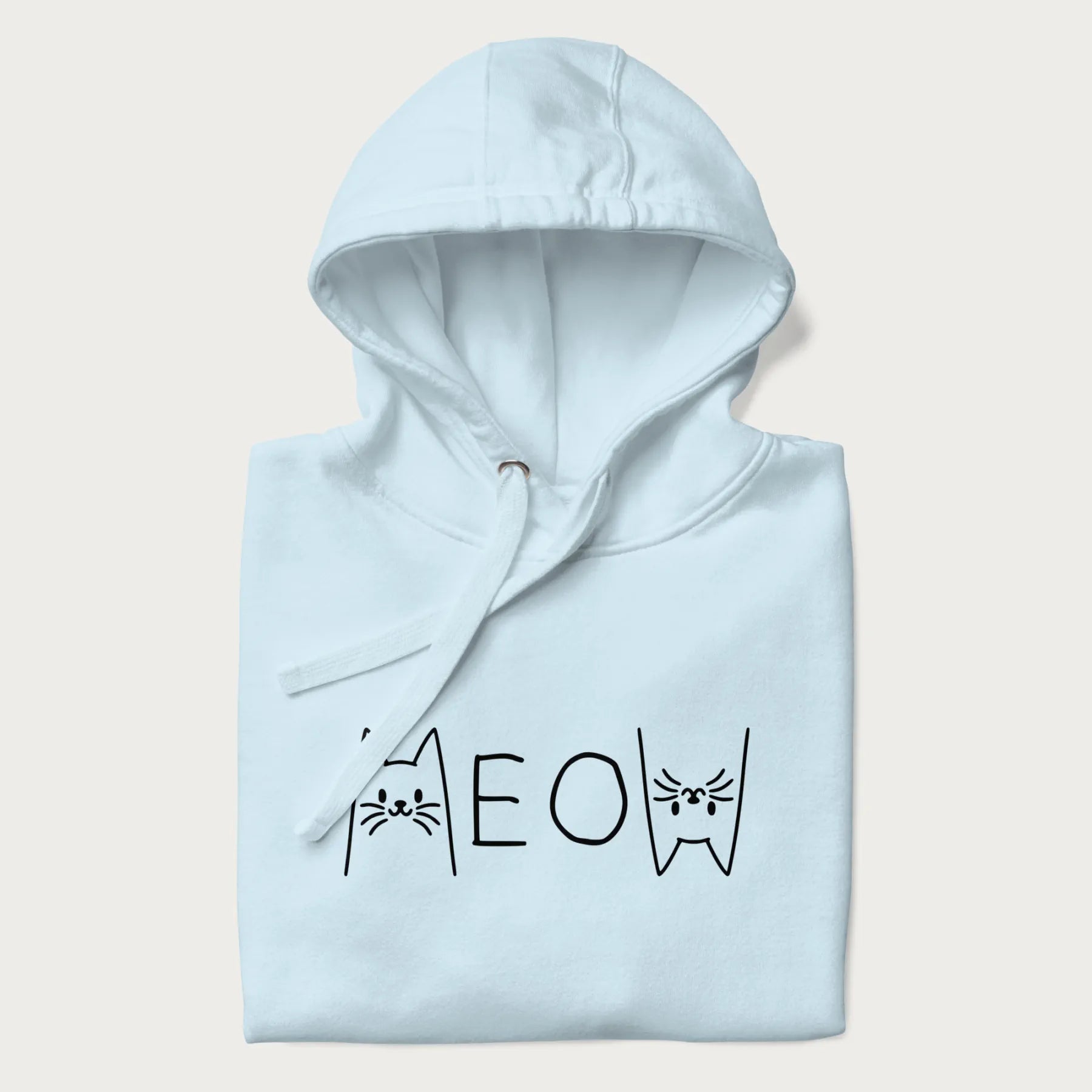 Folded light blue meow hoodie with a simple 'MEOW' text and cute cat face graphics on the front.