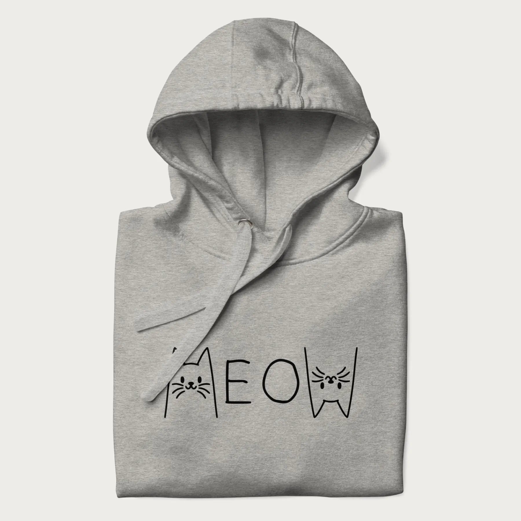Folded light grey meow hoodie with a simple 'MEOW' text and cute cat face graphics on the front.