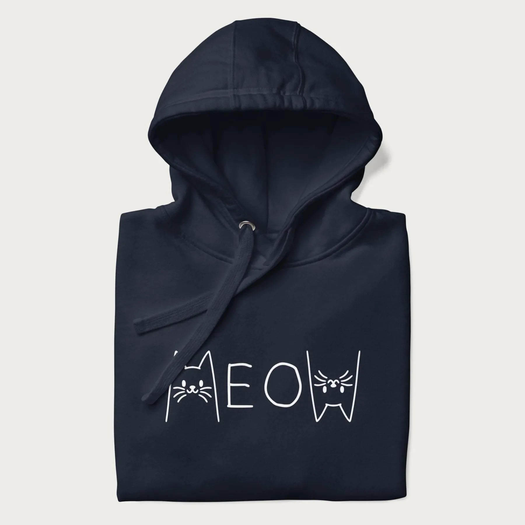 Folded navy meow hoodie with a simple 'MEOW' text and cute cat face graphics on the front.