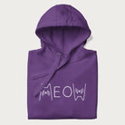 Folded purple meow hoodie with a simple 'MEOW' text and cute cat face graphics on the front.
