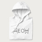Folded white meow hoodie with a simple 'MEOW' text and cute cat face graphics on the front.