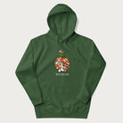 Forest green hoodie with graphic of a frog in a Santa hat on a mushroom with Christmas lights and the text 'Merry Christmas' below.