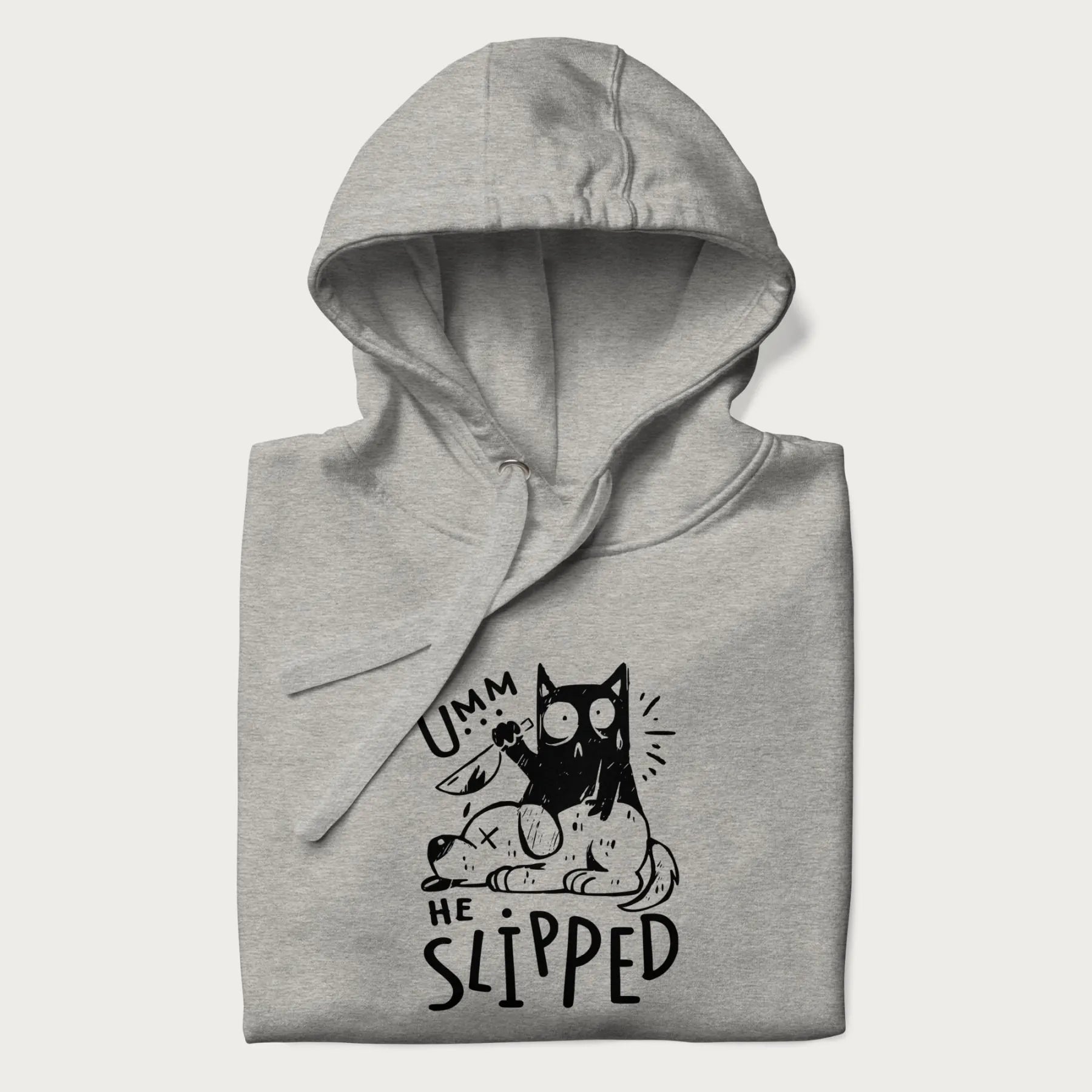 Folded light grey hoodie with a graphic of a black cat holding a knife over a dog with a funny phrase 'Umm, He Slipped'.