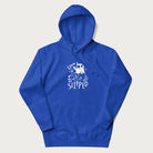 Royal blue hoodie with a graphic of a white cat holding a knife over a dog with a funny phrase 'Umm, He Slipped'.