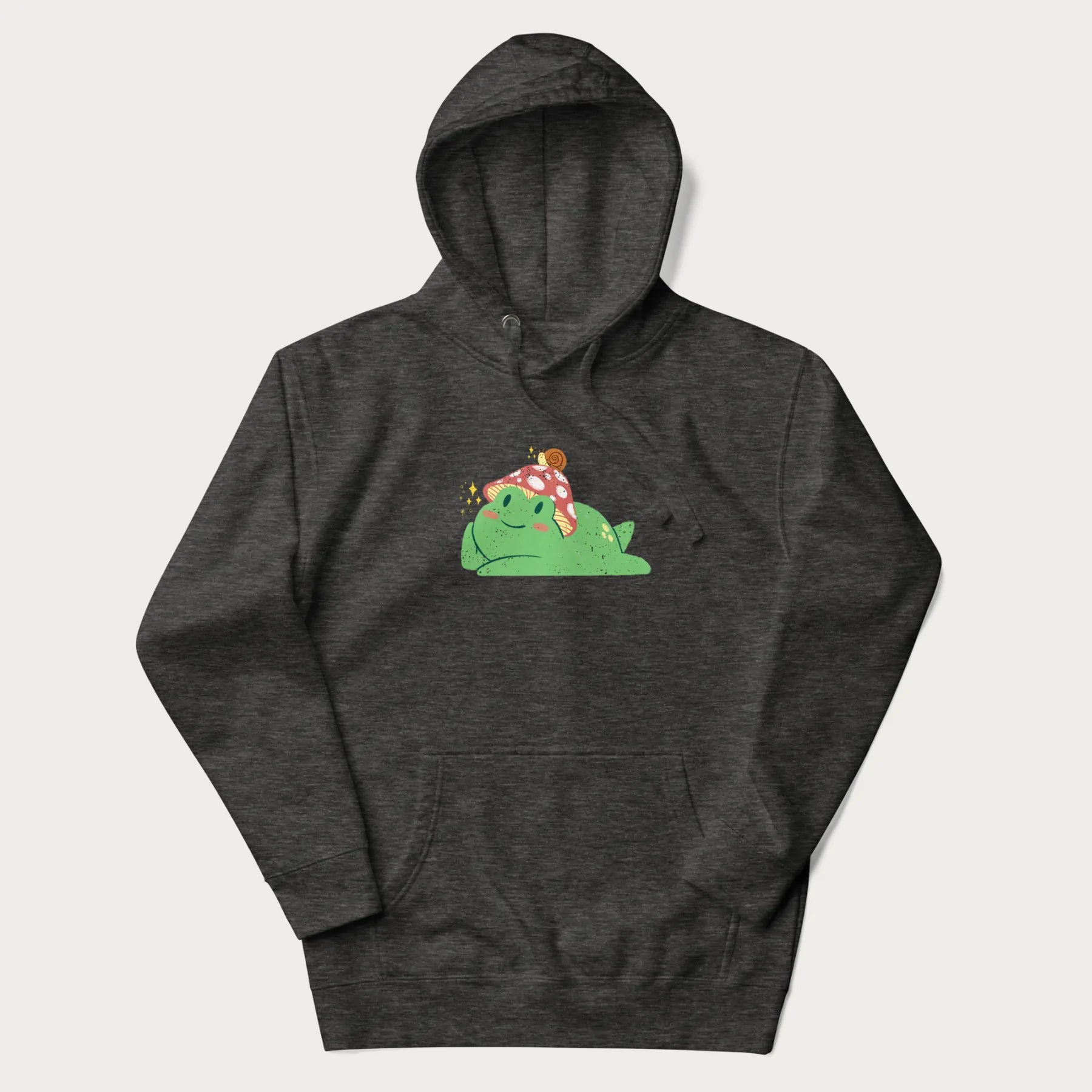 Dark grey hoodie with a cottagecore design of a green frog wearing a mushroom cap and a snail on top.
