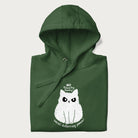 Folded green hoodie with a 'No Touchy, Touchy! Social Distancing Please!' white cat graphic design.