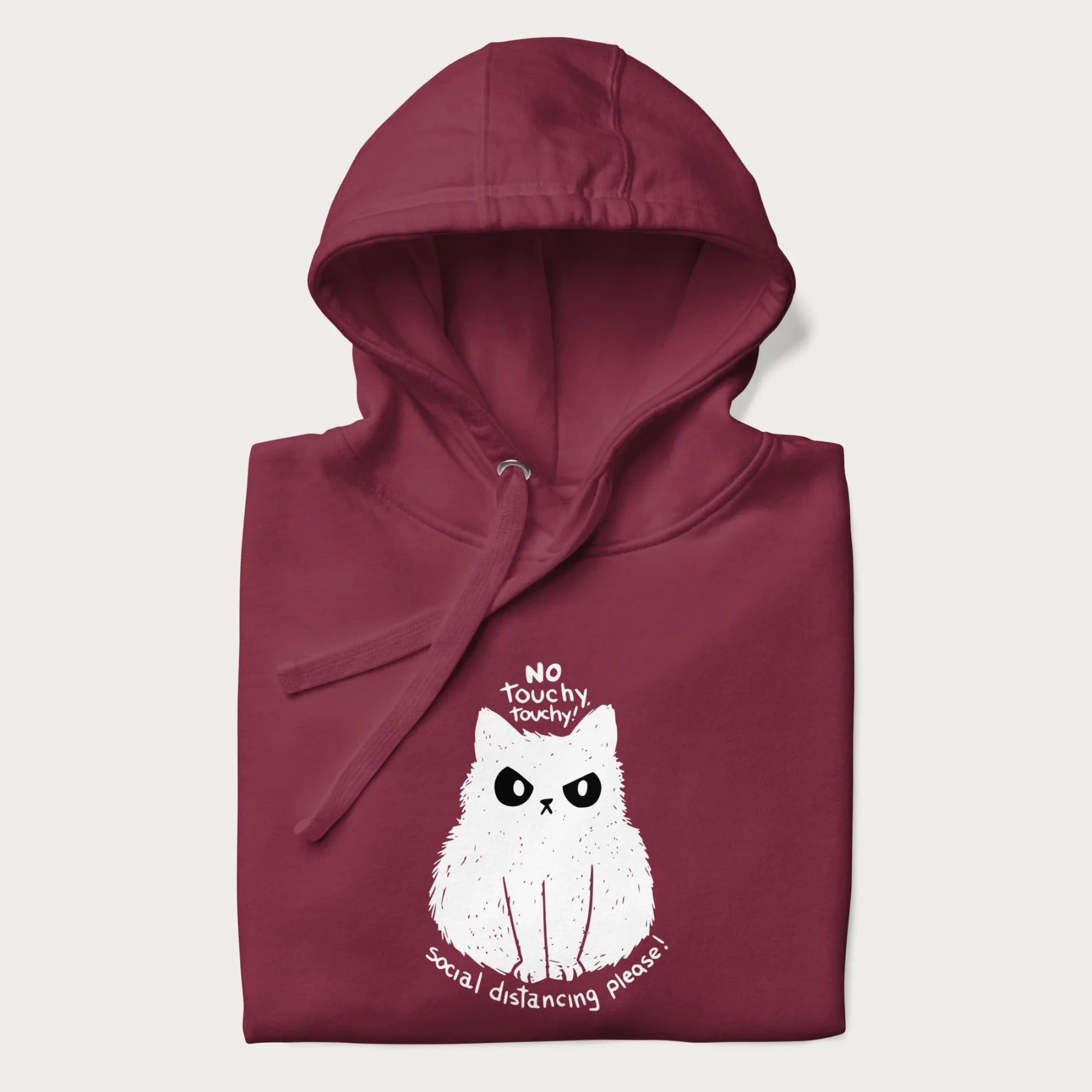 Folded maroon hoodie with a 'No Touchy, Touchy! Social Distancing Please!' white cat graphic design.