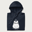Folded navy hoodie with a 'No Touchy, Touchy! Social Distancing Please!' white cat graphic design.