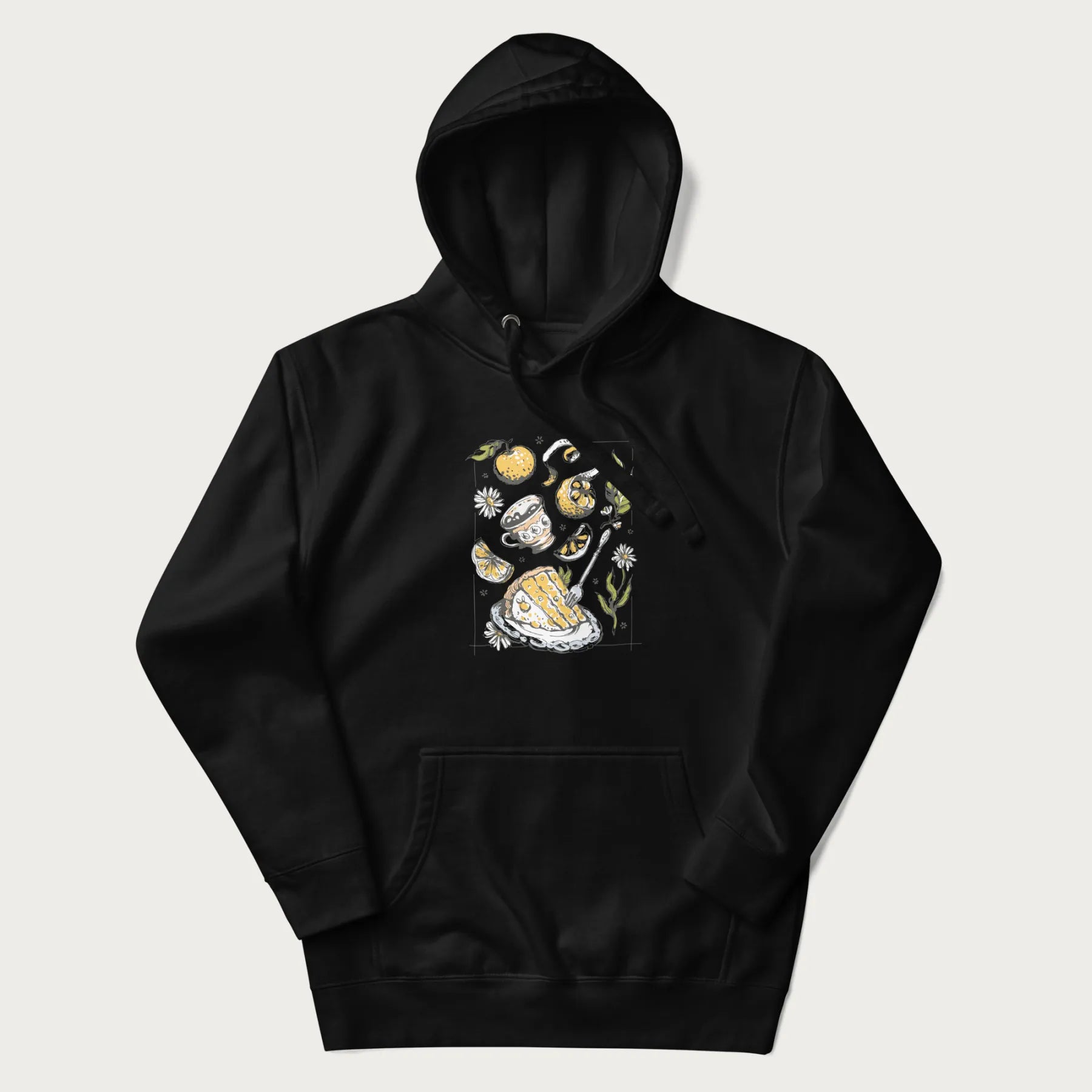 Black hoodie featuring a Cottagecore-themed graphic with oranges, a floral porcelain cup, orange pie, and daisies.