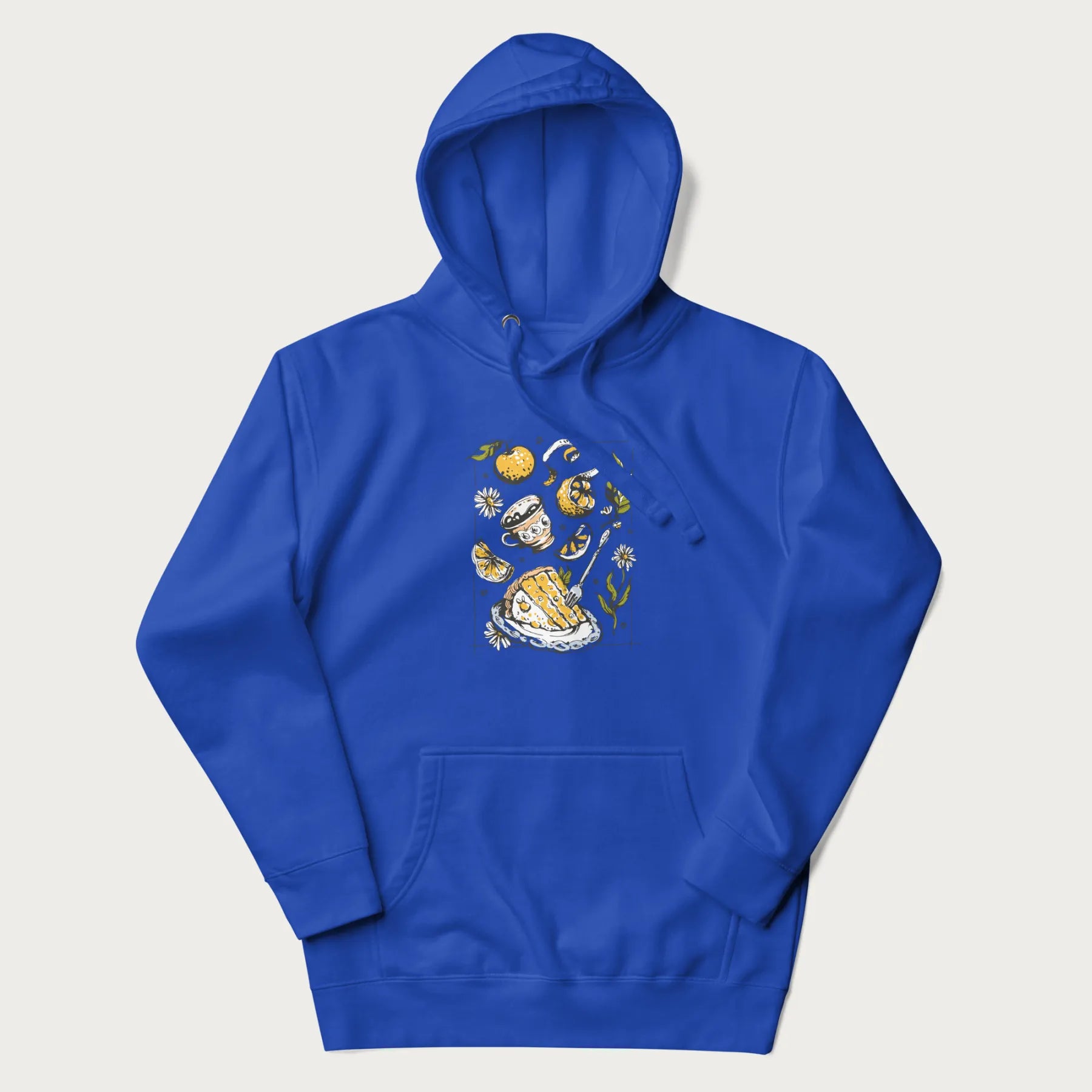 Royal blue hoodie featuring a Cottagecore-themed graphic with oranges, a floral porcelain cup, orange pie, and daisies.